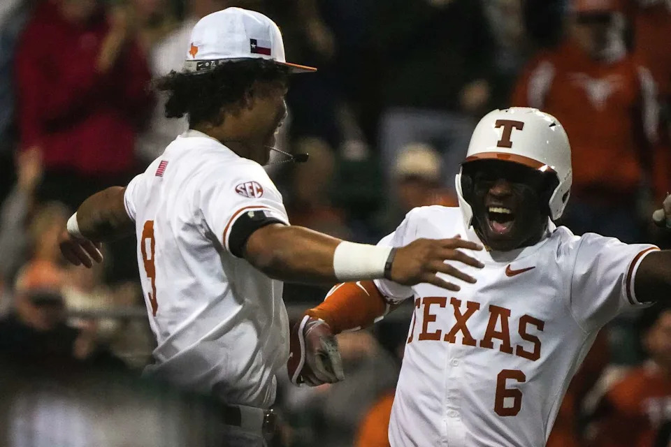 Texas Longhorns outfielder Jonah Williams (9) celebrates a home run by Anthony Pack Jr. (6) during the game against Michigan State at UFCU Disch-Falk Field on Friday, Feb. 20, 2026 in Austin. (Aaron E. Martinez/Austin American-Statesman)