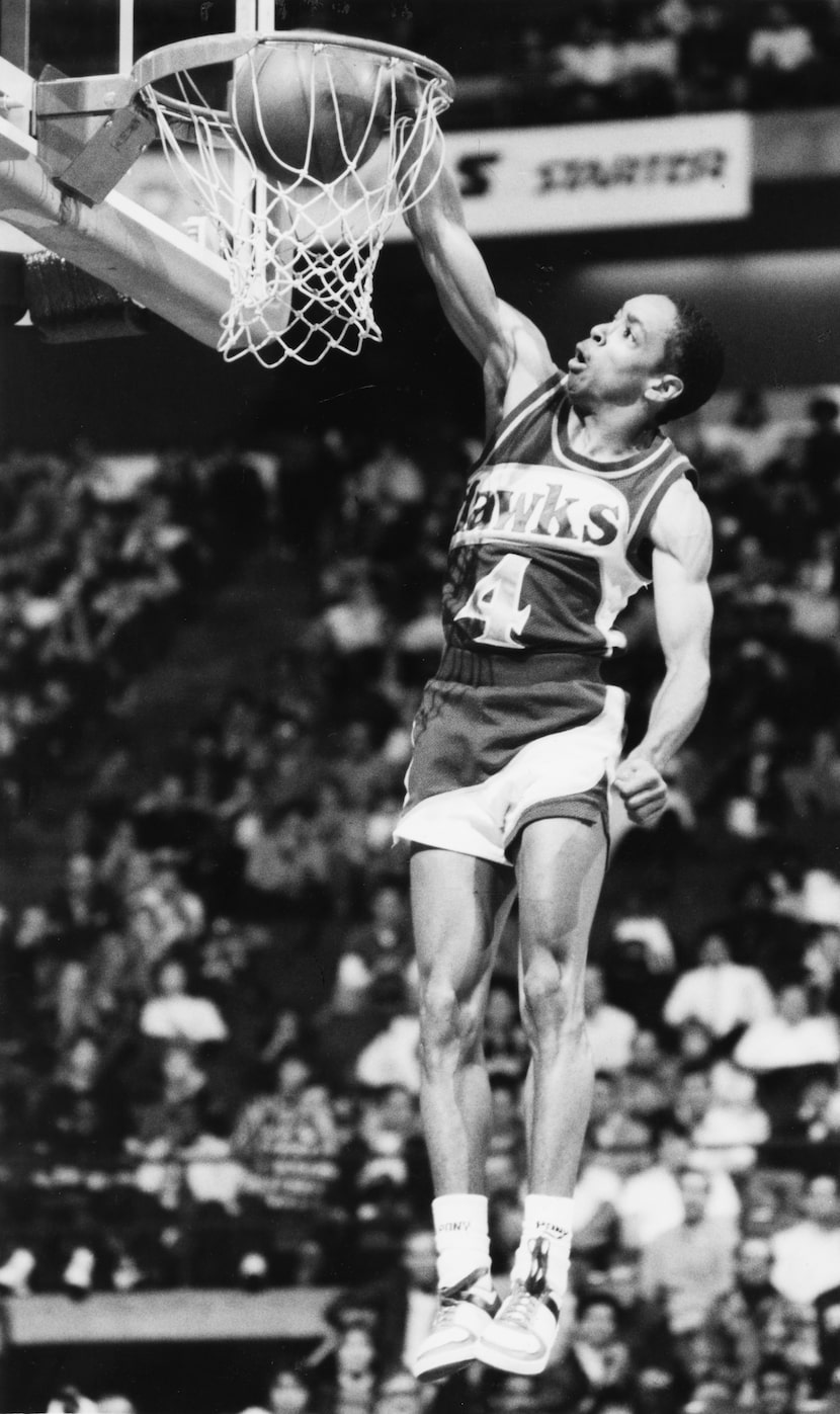 Spud Webb dunks in the 1986 NBA slam dunk contest at Reunion Arena in Dallas.