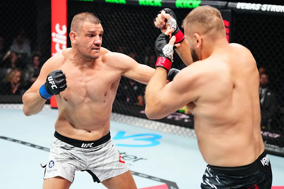 PARIS, FRANCE - SEPTEMBER 06: (L-R) Ante Delija of Croatia punches Marcin Tybura of Poland in their heavyweight fight during the UFC Fight Night event at The Accor Arena on September 06, 2025 in Paris, France. (Photo by Jeff Bottari/Zuffa LLC)