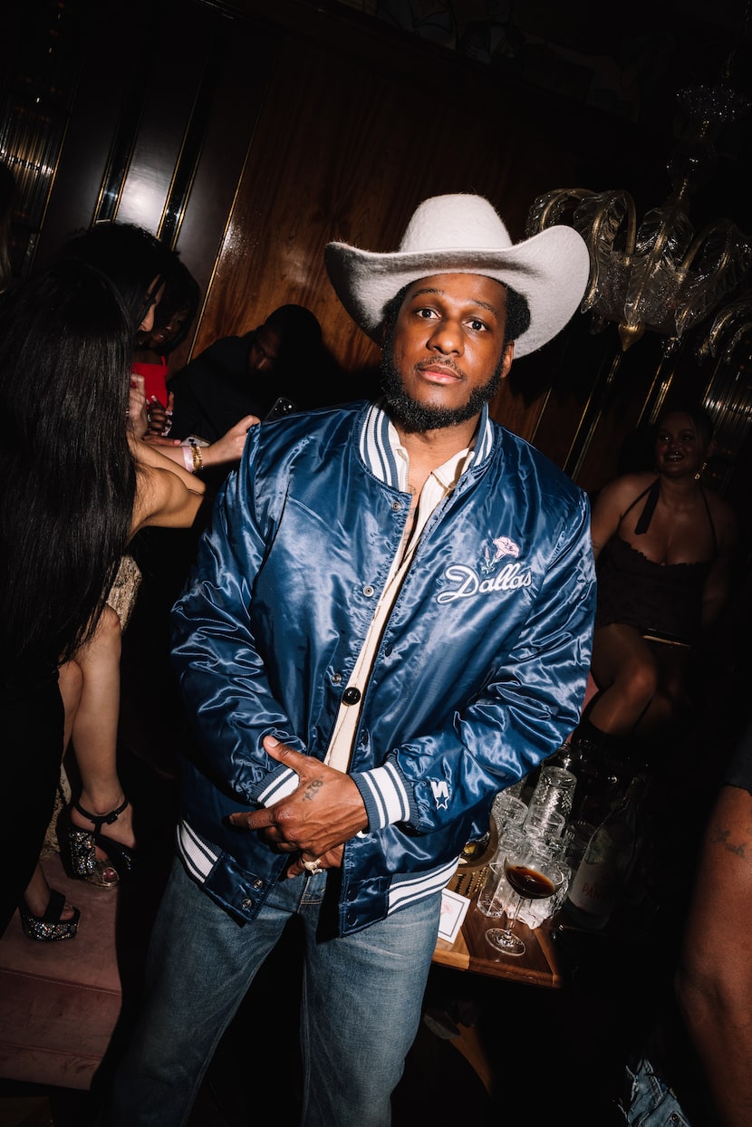 Musician Leon bridges attended a VIP party for Delilah in Dallas. The back of his jacket...