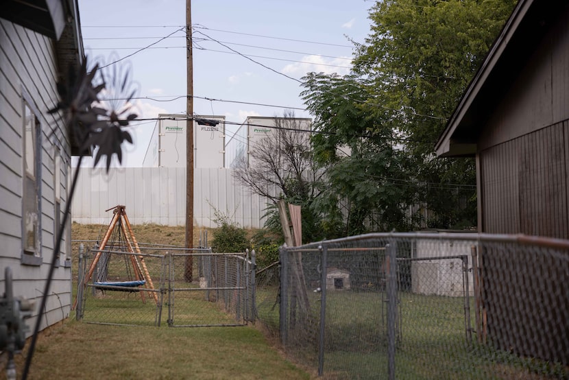 The back of a trucking center can be seen from the backyard of Letitia Wilbourn, a longtime...