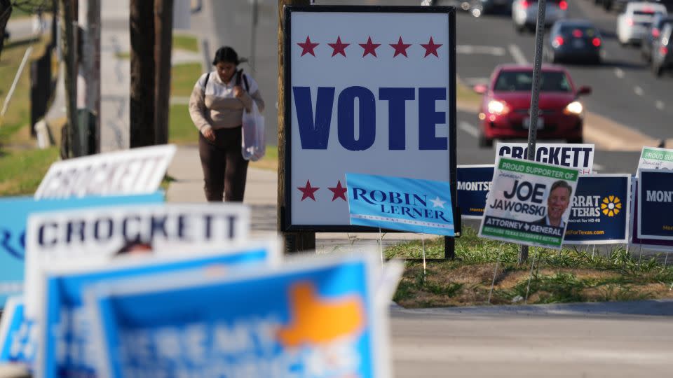 Election signs crowd an intersection near a polling place in Austin, Texas, Tuesday, February 17. - Eric Gay/AP