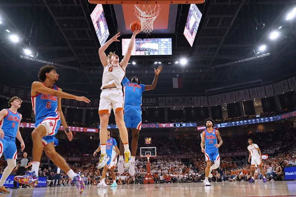 AUSTIN, TEXAS – FEBRUARY 7: Matas Vokietaitis #8 of the Texas Longhorns lays in a basket over Corey Chest #1 and Ilias Kamardine #6 of Ole Miss Rebels during the second half at Moody Center on February 7, 2026 in Austin, Texas. (Photo by Scott Wachter/Getty Images)