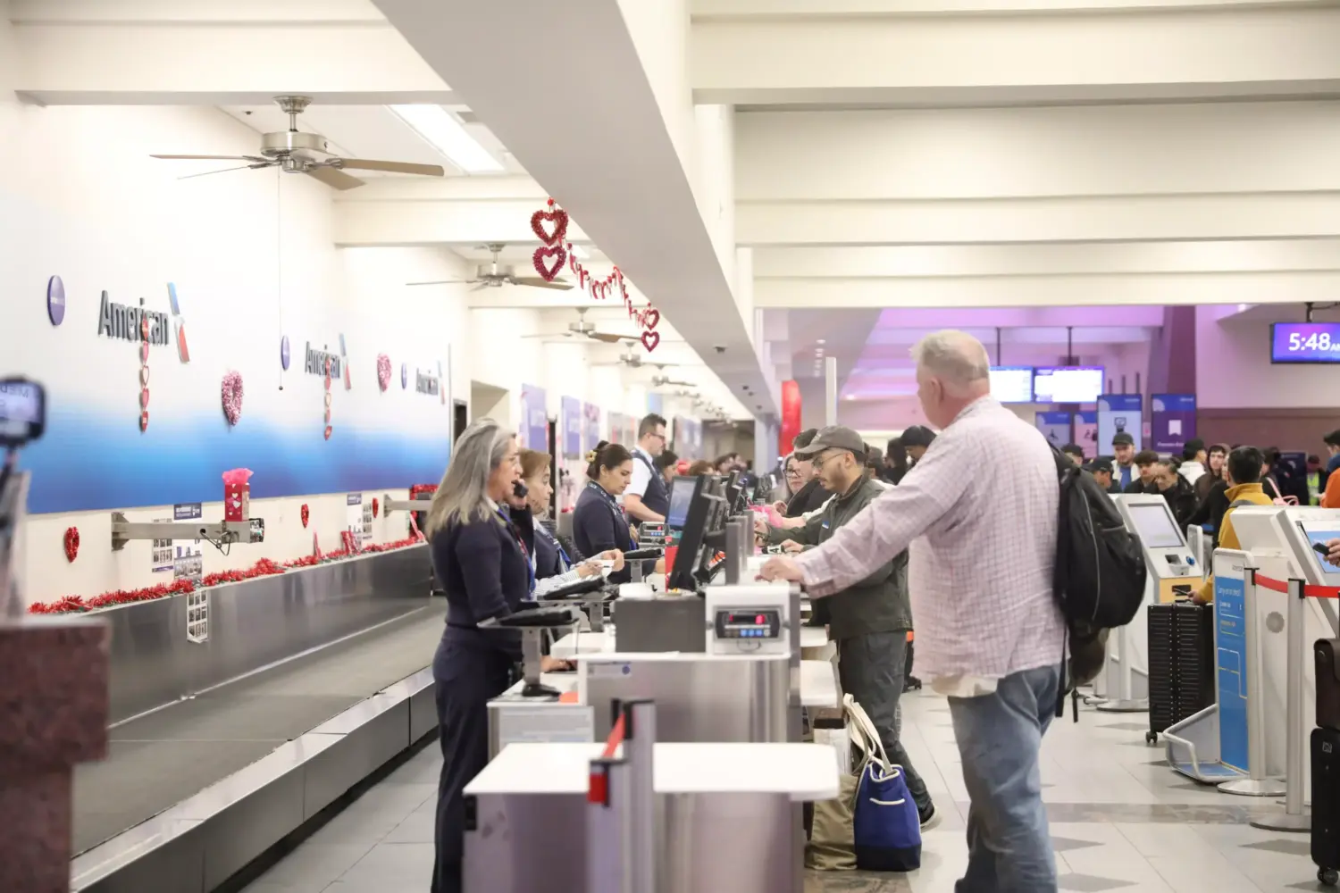 Passengers at the El Paso International Airport check on the status of their flights amid a temporary flight restriction for El Paso airspace. The TFR will last for 10 days, according to a notice from the Federal Aviation Administration.