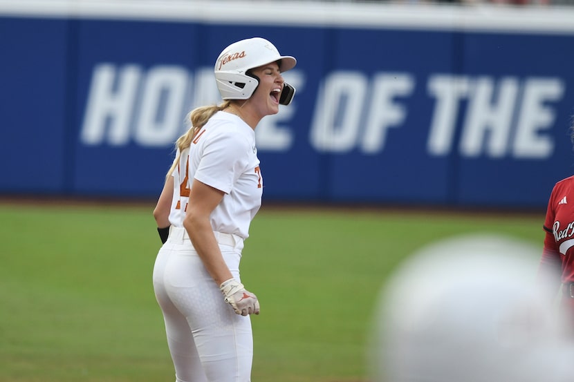 Texas' Reese Atwood celebrates after the Longhorns score during the third game of the NCAA...