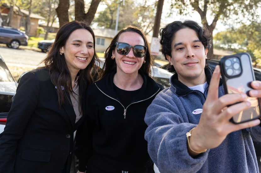 At left, State Rep. Gina Hinojosa, a democrat candidate for governor, takes a photo with...
