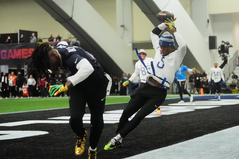 NFC wide receiver George Pickens (3), of the Dallas Cowboys, catches a pass next to AFC...