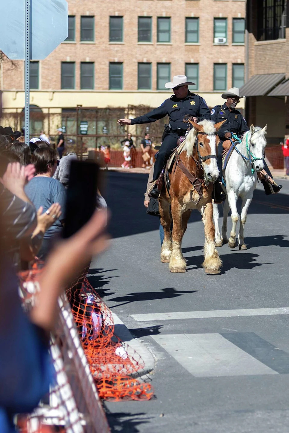 Mounted riders wave to the crowd during the Western Heritage Parade on Saturday, Feb. 7, 2026. (Blaine Young/Contributor)