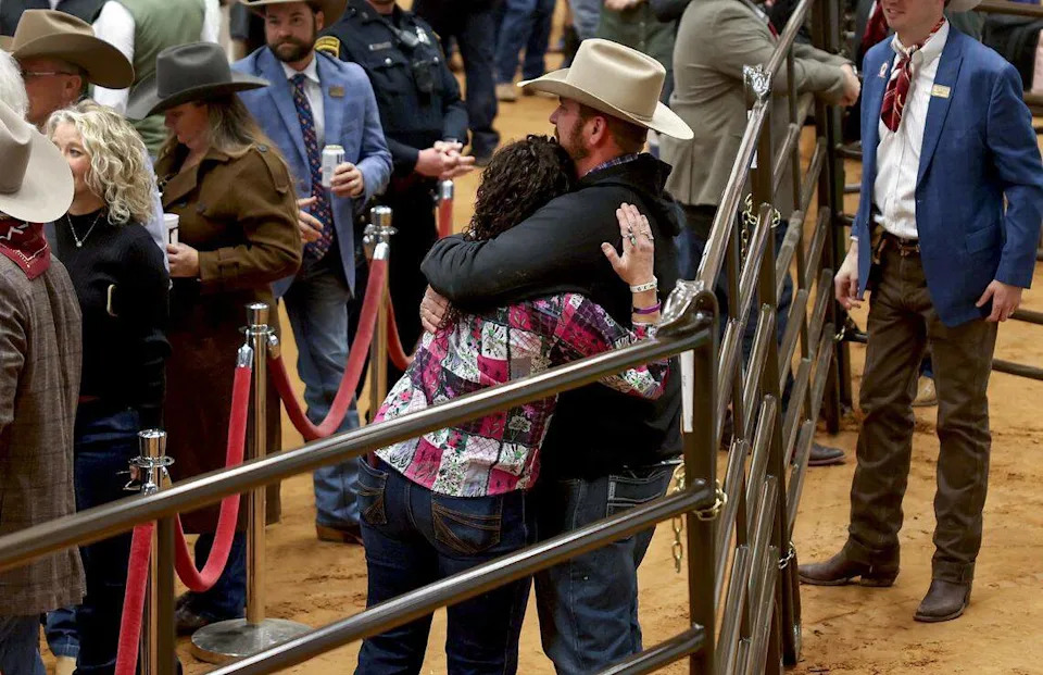 Casey and Bret Cody hug after their son, Caiman Cody received a record-breaking price for his junior grand champion steer at the Fort Worth Stock Show and Rodeo Junior Sale of Champions on Saturday, Feb. 7, 2026. White Castle was bought by Mike Bridges and Gary Menzies of Trico Electric Fort Worth for $550,000.
