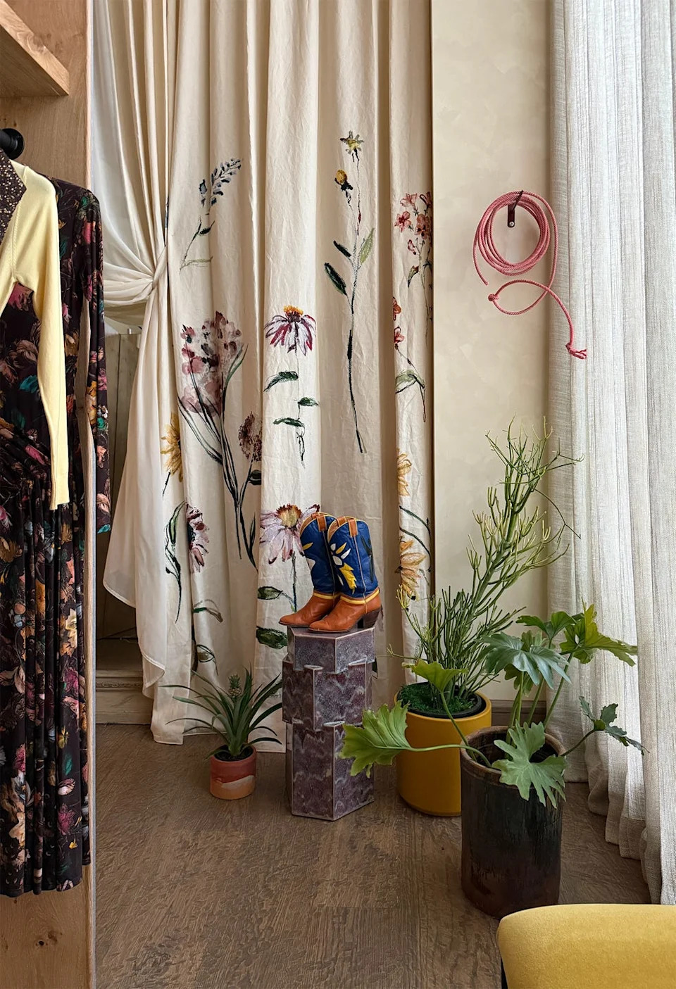 store with cowboys boots and rack of clothing