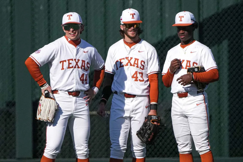 Texas Longhorns outfielders Anthony Pack Jr. (6), Aiden Robbins (43) and Ashton Larson (44) stand in the outfield during the annual Texas Longhorns Alumni Baseball Game at UFCU Disch-Falk Field on Saturday, Jan. 31, 2026 in Austin. (Aaron E. Martinez/Austin American-Statesman)