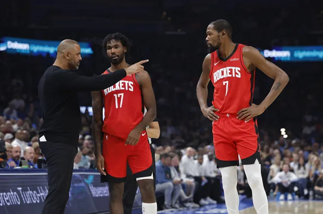 Oct 21, 2025; Oklahoma City, Oklahoma, USA; Houston Rockets head coach Ime Udoka talks to forward Tari Eason (17) and forward Kevin Durant (7) during a break in play against the Oklahoma City Thunder during the first half at Paycom Center. Mandatory Credit: Alonzo Adams-Imagn Images
