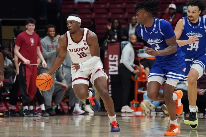 Dec 17, 2025; Stanford, California, USA; Stanford Cardinal forward Chisom Okpara (10) dribbles upcourt while defended by Texas-Arlington Mavericks forward Raysean Seamster (2) and forward/center Cameron Jackson (34) in the first half at Maples Pavilion.