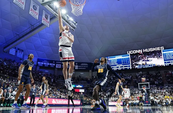 Dec 5, 2025; Storrs, Connecticut, USA; UConn Huskies forward Alex Karaban (11) drives the ball to the basket against East Texas A&M Lions guard Gianni Hunt (25) in the second half at Harry A. Gampel Pavilion.