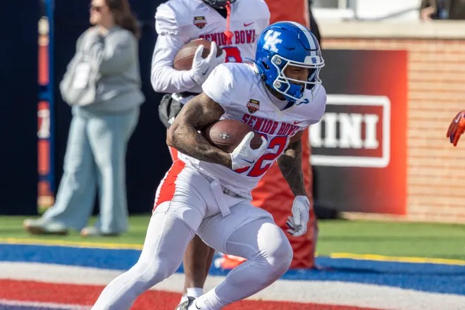 Jan 29, 2026; Mobile, AL, USA; National running back Seth Mcgowan (32) of Kentucky runs the ball during National Senior Bowl practice at Hancock Whitney Stadium. Mandatory Credit: Vasha Hunt-Imagn Images