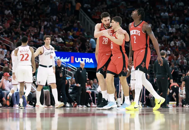 Feb 10, 2026; Houston, Texas, USA; Houston Rockets center Alperen Sengun (28) talks with guard Reed Sheppard (15) after a play during the fourth quarter against the Los Angeles Clippers at Toyota Center. Mandatory Credit: Troy Taormina-Imagn Images