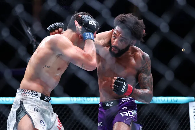 Feb 21, 2026; Houston, Texas, USA; Phil Rowe (red gloves) fights Jean-Paul Lebosnoyani (blue gloves) in a welterweight bout during UFC Fight Night at Toyota Center. Mandatory Credit: Troy Taormina-Imagn Images
