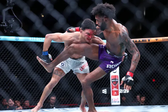 Feb 21, 2026; Houston, Texas, USA; Phil Rowe (red gloves) fights Jean-Paul Lebosnoyani (blue gloves) in a welterweight bout during UFC Fight Night at Toyota Center. Mandatory Credit: Troy Taormina-Imagn Images