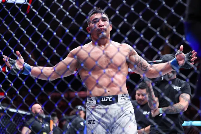 Feb 21, 2026; Houston, Texas, USA; Ramiz Brahimaj (red gloves) fights Punahele Soriano (blue gloves) in a welterweight bout during UFC Fight Night at Toyota Center. Mandatory Credit: Troy Taormina-Imagn Images