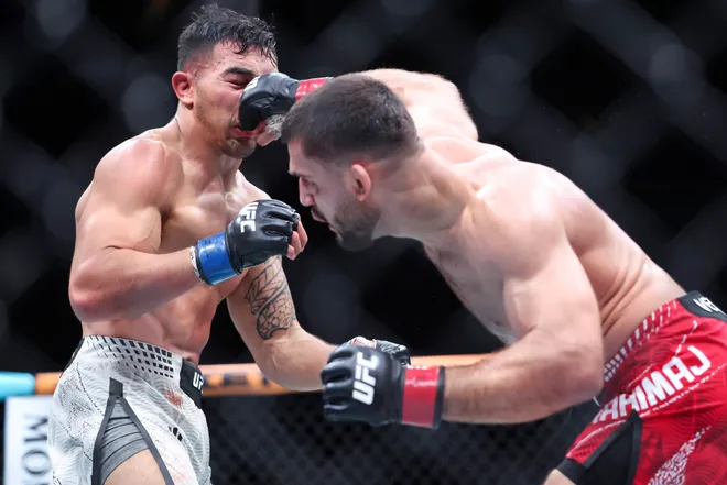 Feb 21, 2026; Houston, Texas, USA; Ramiz Brahimaj (red gloves) fights Punahele Soriano (blue gloves) in a welterweight bout during UFC Fight Night at Toyota Center. Mandatory Credit: Troy Taormina-Imagn Images