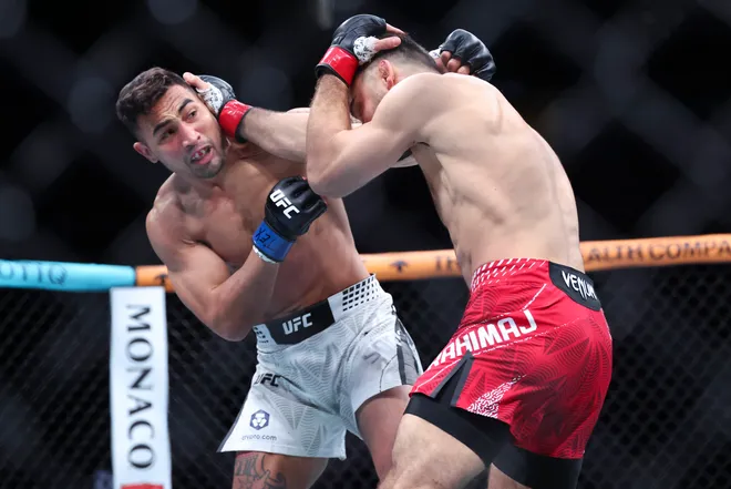 Feb 21, 2026; Houston, Texas, USA; Ramiz Brahimaj (red gloves) fights Punahele Soriano (blue gloves) in a welterweight bout during UFC Fight Night at Toyota Center. Mandatory Credit: Troy Taormina-Imagn Images