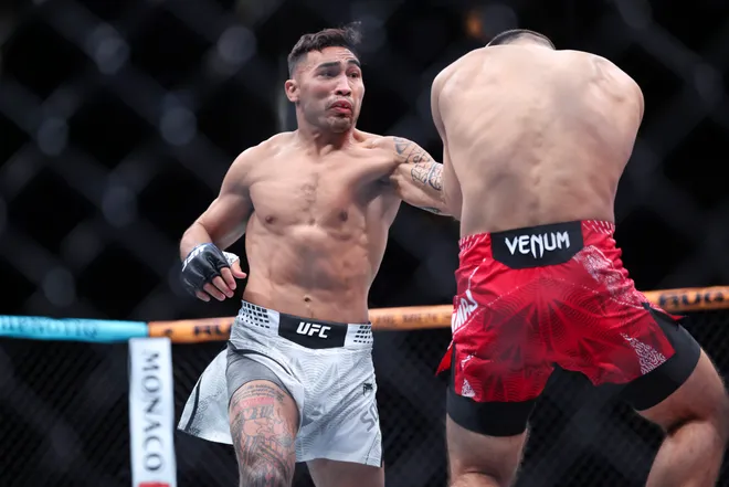 Feb 21, 2026; Houston, Texas, USA; Ramiz Brahimaj (red gloves) fights Punahele Soriano (blue gloves) in a welterweight bout during UFC Fight Night at Toyota Center. Mandatory Credit: Troy Taormina-Imagn Images