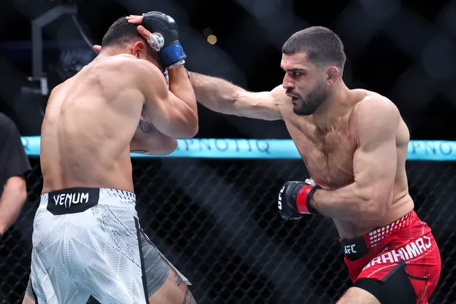 Feb 21, 2026; Houston, Texas, USA; Ramiz Brahimaj (red gloves) fights Punahele Soriano (blue gloves) in a welterweight bout during UFC Fight Night at Toyota Center. Mandatory Credit: Troy Taormina-Imagn Images
