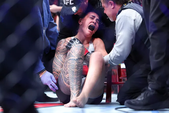 Feb 21, 2026; Houston, Texas, USA; Nora Cornolle (red gloves) fights Joselyne Edwards (blue gloves) in a womens bantamweight bout during UFC Fight Night at Toyota Center. Mandatory Credit: Troy Taormina-Imagn Images