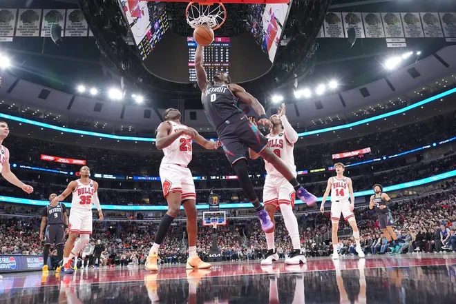 Feb 21, 2026; Chicago, Illinois, USA; Detroit Pistons center Jalen Duren (0) dunks the ball on Chicago Bulls forward Jalen Smith (25) during the first half at United Center.