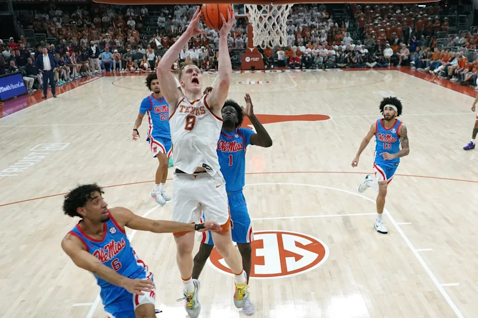 AUSTIN, TEXAS – FEBRUARY 7: Matas Vokietaitis #8 of the Texas Longhorns lays in a basket over Corey Chest #1 and Ilias Kamardine #6 of Ole Miss Rebels during the second half at Moody Center on February 7, 2026 in Austin, Texas. (Photo by Scott Wachter/Getty Images)