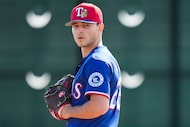 Texas Rangers pitcher Jack Leiter participates in a fielding drill during a spring training...
