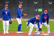 Texas Rangers shortstop Corey Seager fields a ball at second base as (from left) Josh Smith,...