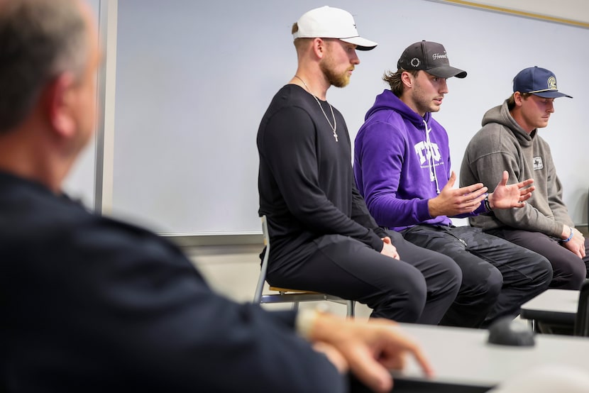 TCU football coach Sonny Dykes (far left) listens as quarterbacks (from left) Shane...