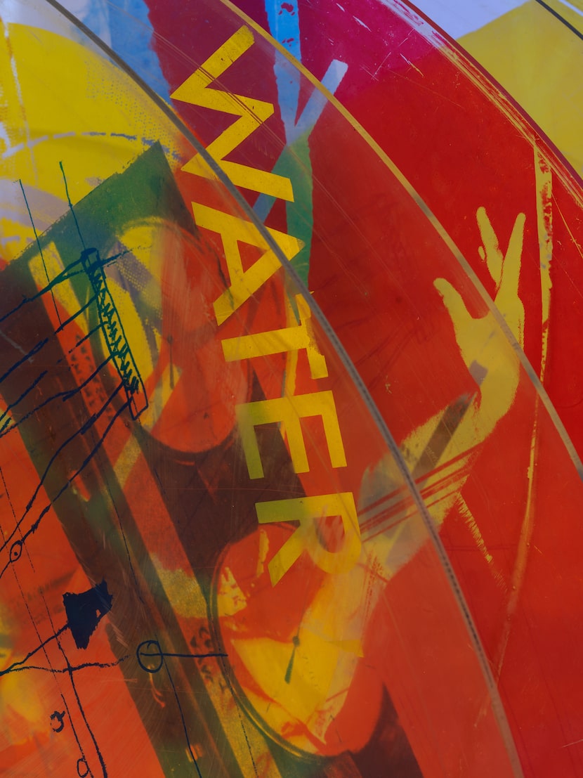 Installation view of Robert Rauschenberg, "Revolver V" (detail), 1967. Silkscreen ink on...