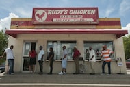 Customers line up to order from Rudy's Chicken on S. Lancaster.  It's owner Rudolph Edwards...