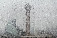 Reunion Tower is seen behind raindrops in downtown Dallas, Wednesday, Dec. 4, 2024.