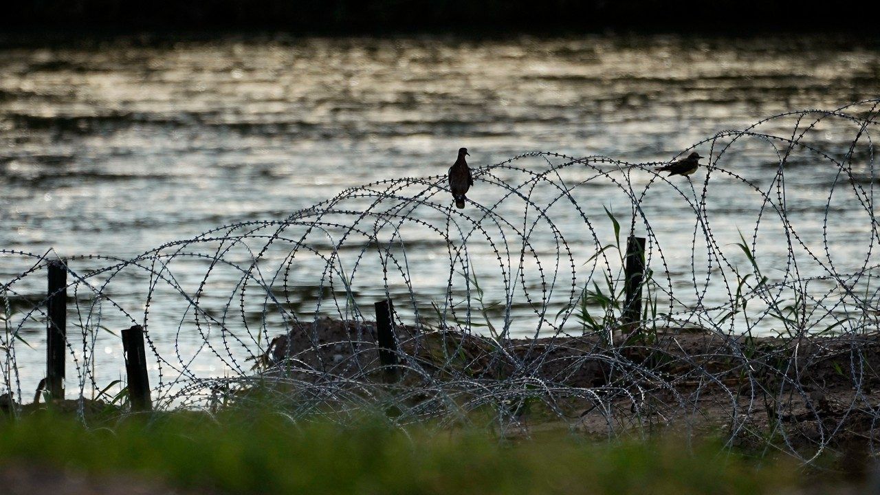 Birds rest on concertina wire, or razor wire, along the Rio Grande in Eagle Pass, Texas, July 6, 2023. (AP Photo/Eric Gay, File)