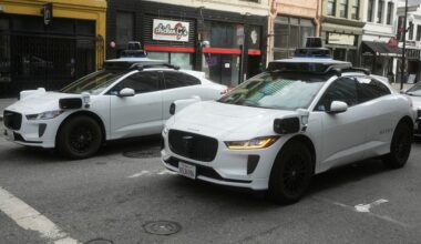 Waymo vehicles wait at an intersection in San Francisco, Wednesday, Oct. 22, 2025. (AP Photo/Jeff Chiu)