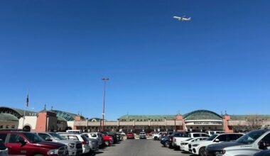 A plane flies over El Paso International Airport, Wednesday, Feb. 11, 2026, in El Paso, Texas. (AP Photo/Morgan Lee)