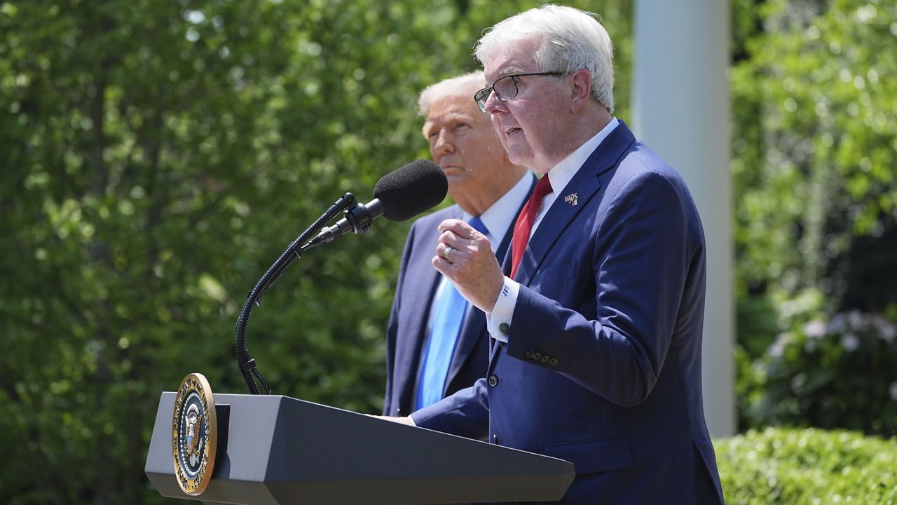 Lt. Gov. of Texas Dan Patrick speaks as President Donald Trump listens during a National Day of Prayer event in the Rose Garden of the White House, Thursday, May 1, 2025, in Washington. (AP Photo/Evan Vucci)