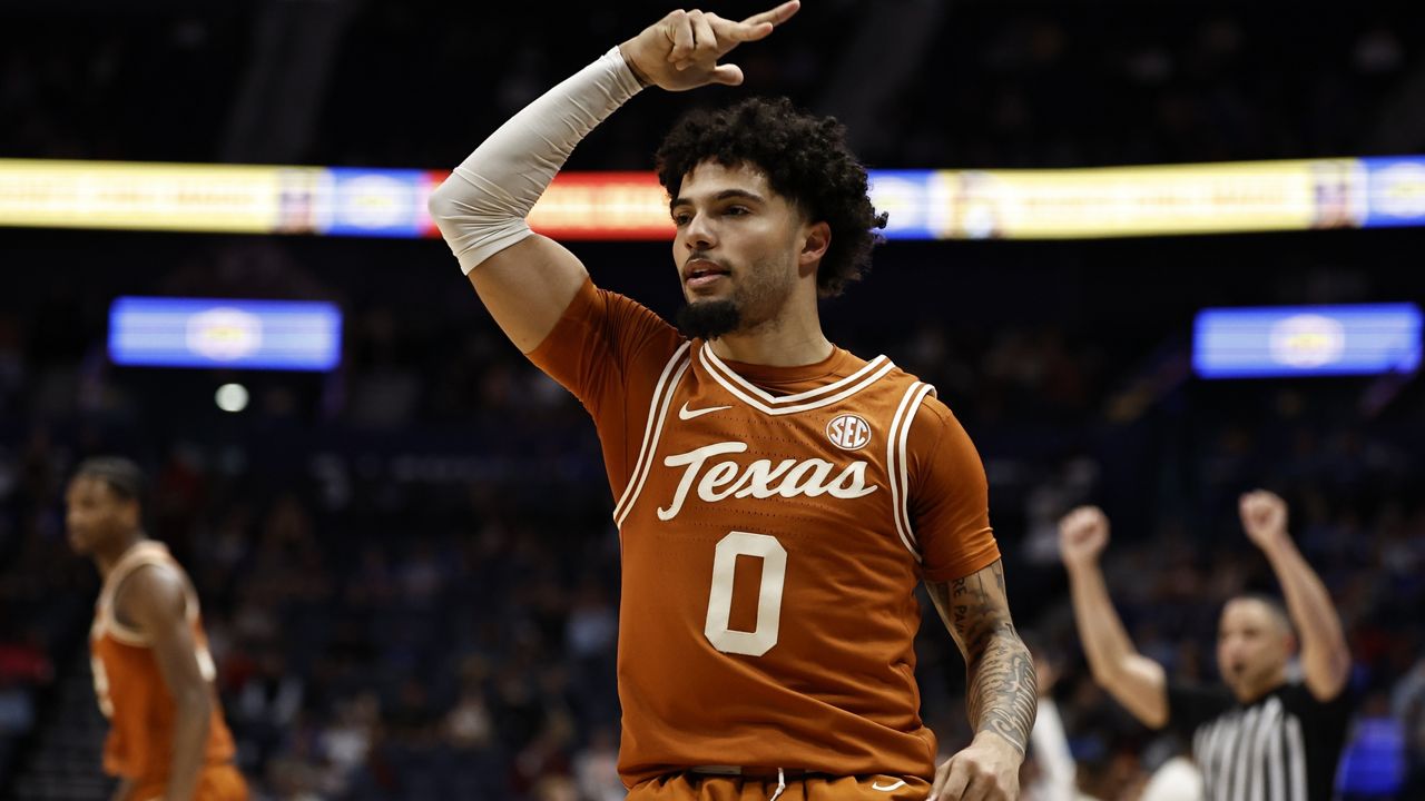 Texas guard Jordan Pope (0) celebrates his three-point shot against Texas A&M during the first half of an NCAA college basketball game in the second round of the Southeastern Conference tournament, Thursday, March 13, 2025, in Nashville, Tenn. (AP Photo/Wade Payne)