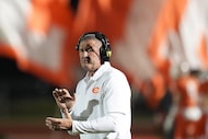 Celina head coach Bill Elliott applauds after Wyatt Villarreal scored on a 49-yard touchdown...