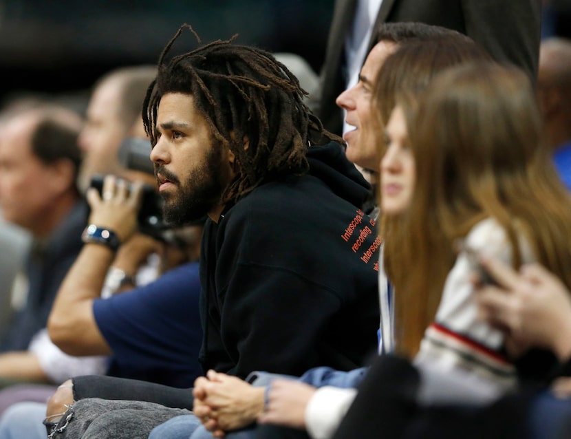 Musical artist J. Cole watches a game between Dallas Mavericks and the Detroit Pistons...