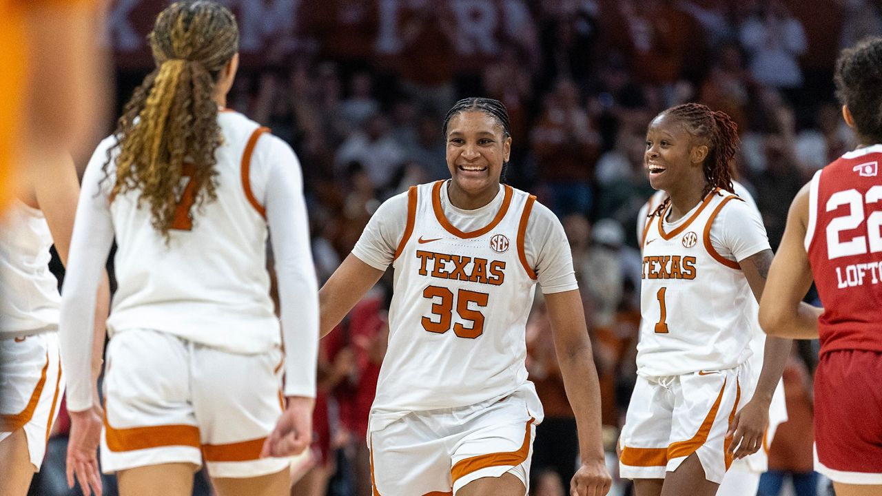 Texas guard Jordan Lee, left, forward Madison Booker (35) and guard Bryanna Preston (1) celebrate during a timeout in the second half of an NCAA college basketball game against Oklahoma, Sunday, Feb. 1, 2026, in Austin, Texas. (AP Photo/Stephen Spillman)