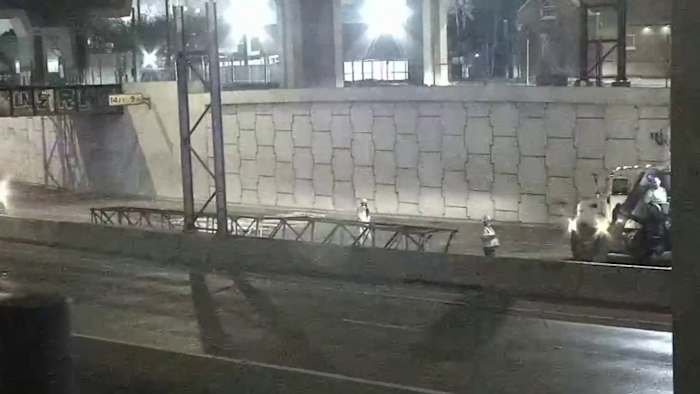 Asphalt truck clips overhead traffic sign, prompting hourslong closure of downtown highway