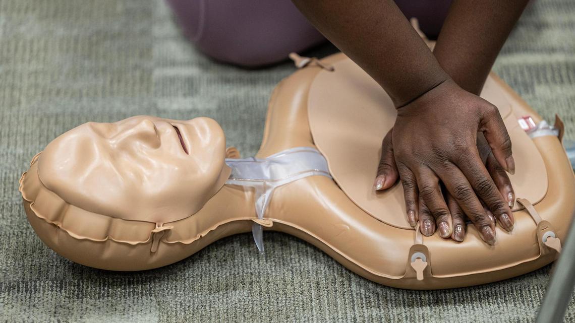 Cassandra Walker practices chest compressions during a CPR class at the Pat May Center in Bedford on Tuesday, Oct. 29, 2024.