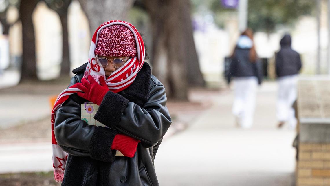 Graduate student Jaylynn West walks to class bundled up in a scarf and beanie on campus at TCU in Fort Worth on Wednesday, Feb. 19, 2025.