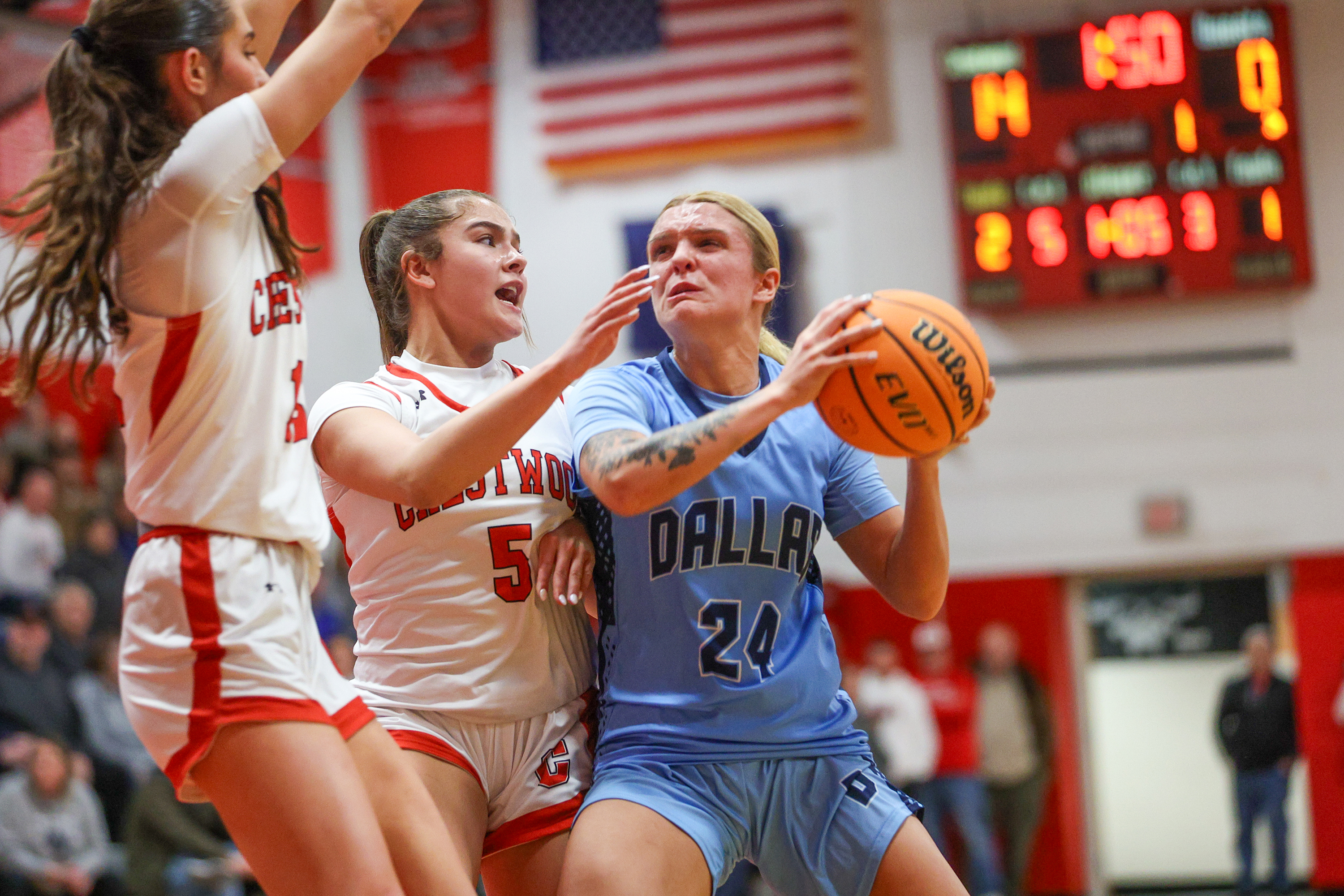 Dallas’ Molly Walsh drives toward the basket during a basketball...