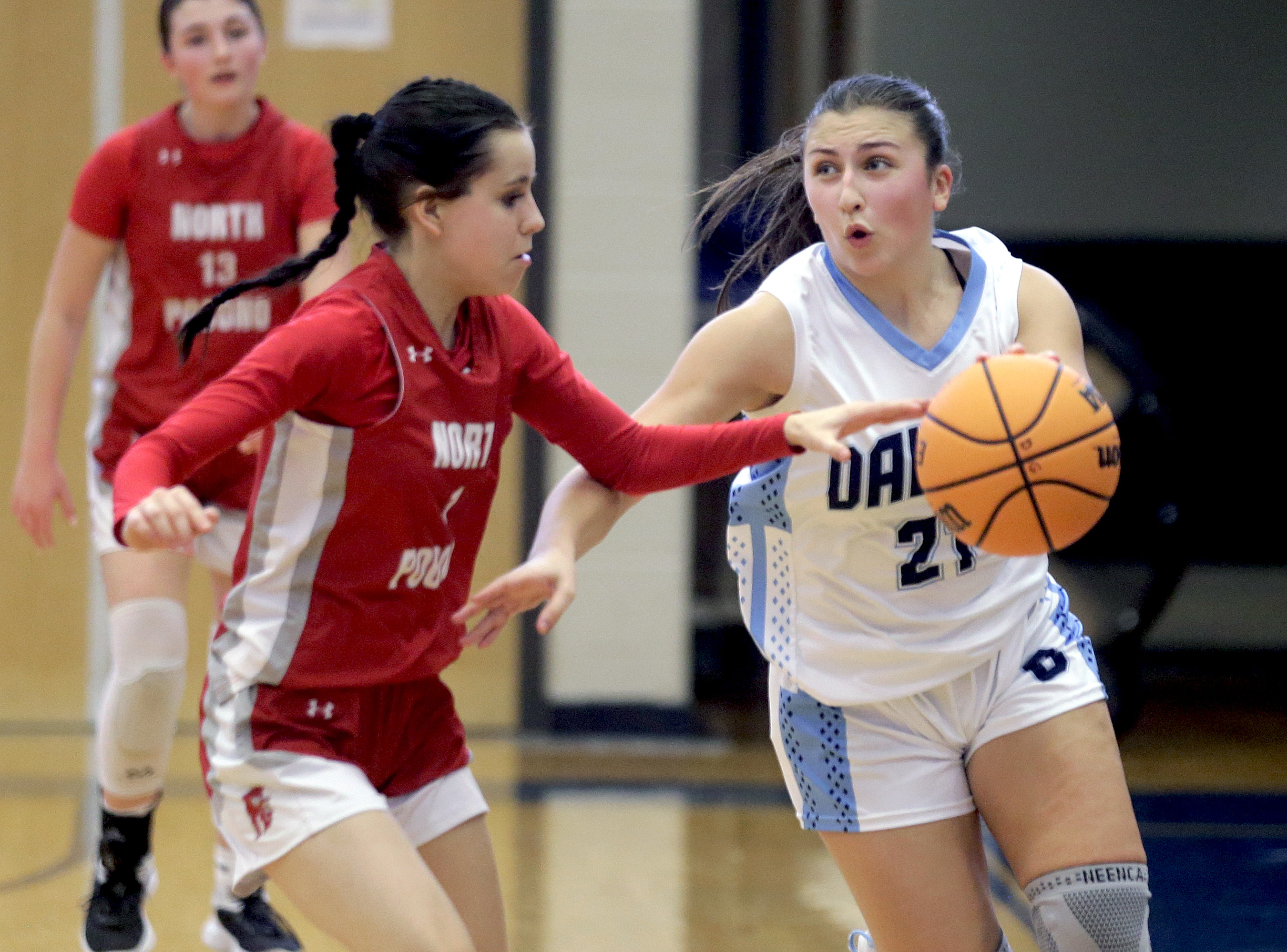 Dallas’ Brianna Casey, right, gets past North Pocono defender Trinity...
