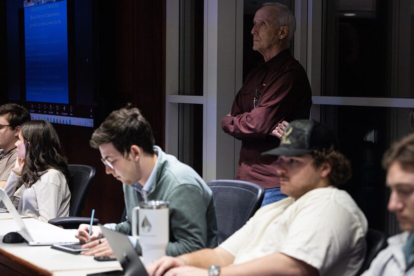Texas Christian University professor Tom Seng listens to a remote guest speaker during a...